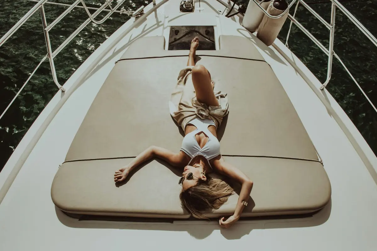 Person relaxing on boat Person relaxing on boat